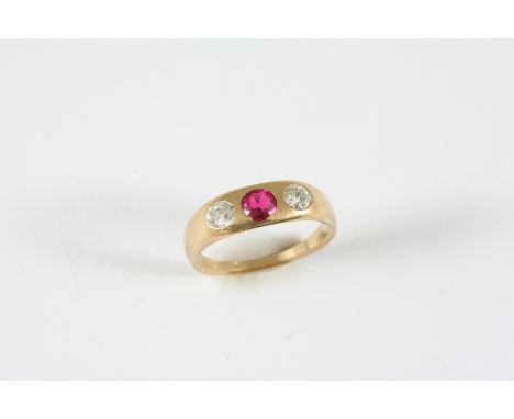 A GOLD AND GEM SET GYPSY RING the gold band is mounted with two old brilliant-cut diamonds and a circular synthetic ruby. Siz