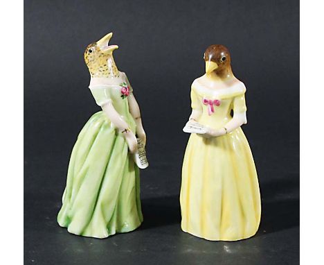 JENNY LIND AS CONFIDENCE AND DIFFIDENCE, two Royal Worcester candle extinguishers, date codes for 1919 and circa 1900, height