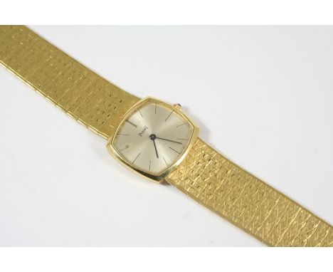 A LADY'S 18CT. GOLD WRISTWATCH BY PIAGET the signed cushion-shaped dial with baton numerals, numbered to the reverse 9531 A 2