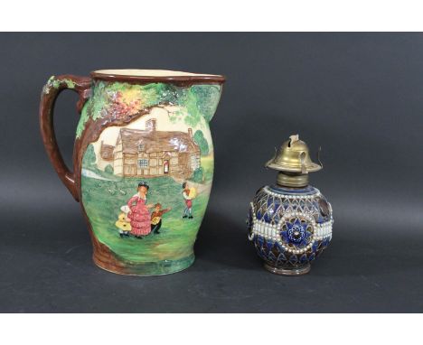 ROYAL DOULTON OIL LAMP a small stoneware oil lamp with applied and incised decoration, mounted with an oil lamp fitting. Also