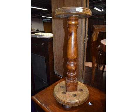 A stained frame stick stand