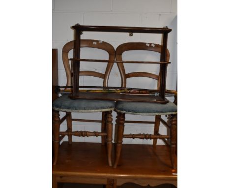 A late 19th/early 20th Century mahogany wall shelf, waterfall style with spindle ends, width approx. 64cm, and a pair of Vict