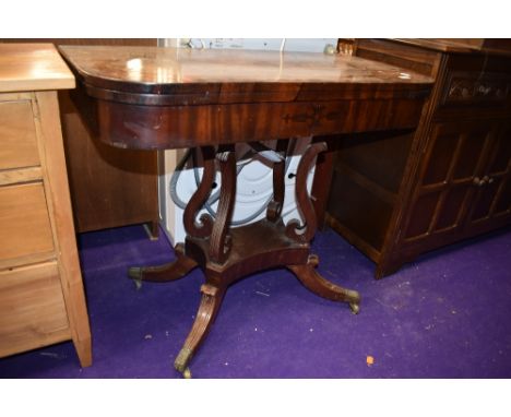 A 19th Century mahogany and inlaid fold over card table, complete but in need of some restoration
