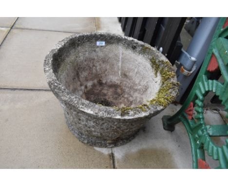 A cast stone style garden trough or planter