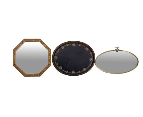 A Victorian papier-mache and mother of pearl inlaid oval tray, 75cm long, a 1920's oxidised brass oval mirror, 49cm x 76cm, a