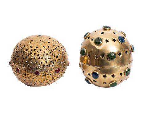 A late 19th century pierced brass shadow lantern, 18cm diameter, together with one other later shadow lantern inset with gree