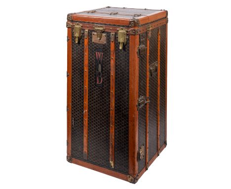 MALLES GOYARD.. A canvas, leather bound and brass mounted steamer trunk with hinged top and front enclosing a leather lined i