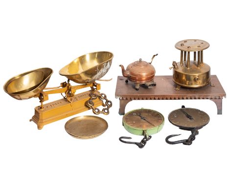 A set of iron and brass mounted countertop scales, early 20th century; 23cm high, 61cm wide; two spring balances by Salter; a