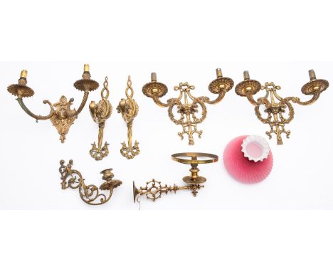 A pair of cast brass twin light applique with foliate scroll decoration, 31cm across, a similar twin branch applique, a pair 