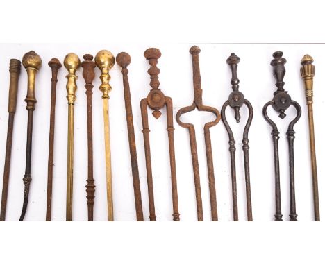 A quantity of wrought iron and brass mounted fire tools, 19th century; including various pokers, tongs and a shovel; the long