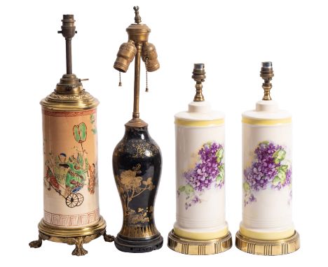 A gilt chinoiserie ceramic twin light table light, a pair of ceramic cylindrical brass mounted table lamps decorated with vio