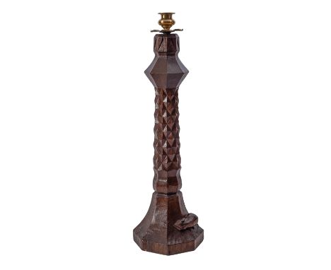 Robert Thompson of Kilburn, a 'Mouseman' oak table lamp, the octagonal adzed column with brass sconce, the spreading base wit