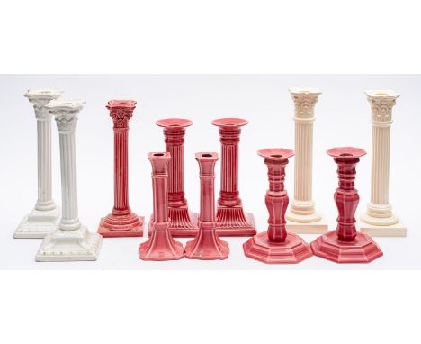Five pairs of white and pink glazed candlesticks and one single candlestick. 