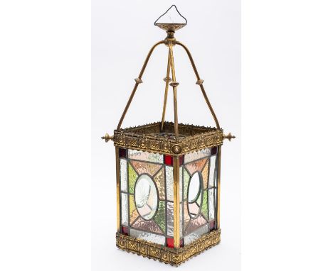 A late Victorian brass and leaded stained glass hall lantern, the square glass panels with oval stellar centres, green, red, 