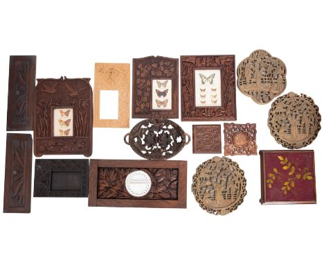 A collection of assorted relief carved wood items, 19th and early 20th century; including five photograph frames, two coaster