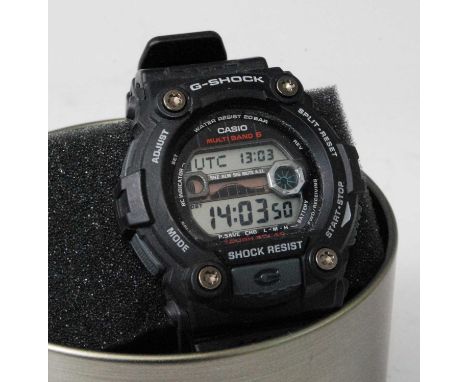 A gent's Casio G-Shock digital wristwatch, in presentation tin, outer card box, and with various papers; together with a Casi