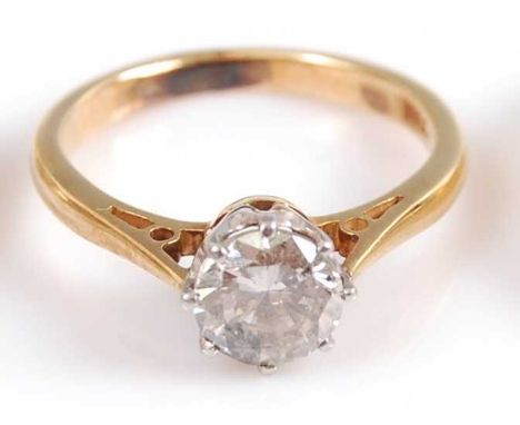 A yellow and white metal diamond single stone ring, comprising a round brilliant cut diamond in an eight claw Rex collect set