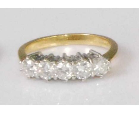 An 18ct gold diamond five stone ring, the claw set brilliants in a line setting, each weighing approx 0.2 carats, 4g, size K/