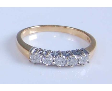 An 18ct yellow and white gold five-stone diamond half hoop eternity ring, comprising five round brilliant cut diamonds in cla