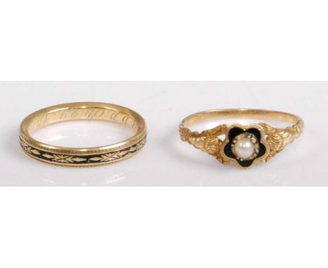 A George III yellow metal and black enamel mourning ring, inscribed to the inside of the band and bearing date 1782, 4.2g, un