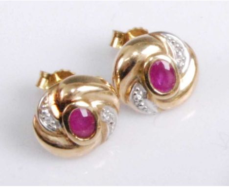 A pair of contemporary 9ct gold, ruby and diamond highlight set ear studs, the whole in a stylised flower head setting, 2.4g,