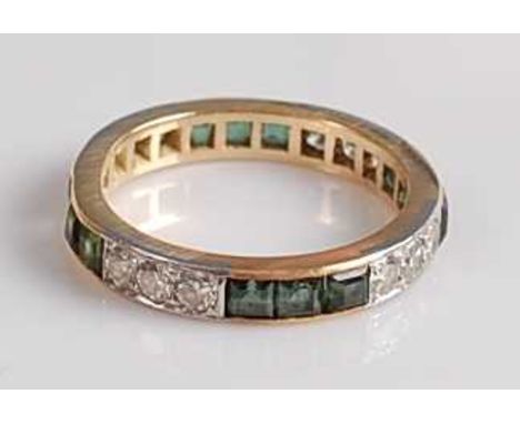 A yellow and white metal, tourmaline and diamond full hoop eternity ring, featuring four alternating sections of three round 