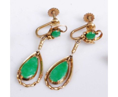 A pair of early 20th century yellow metal and green jade set ear clips, each with pear shaped drops, having screw backs, unma