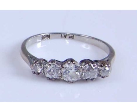 A yellow and white metal diamond five-stone half hoop eternity ring, featuring five graduated Old European cut diamonds in cl