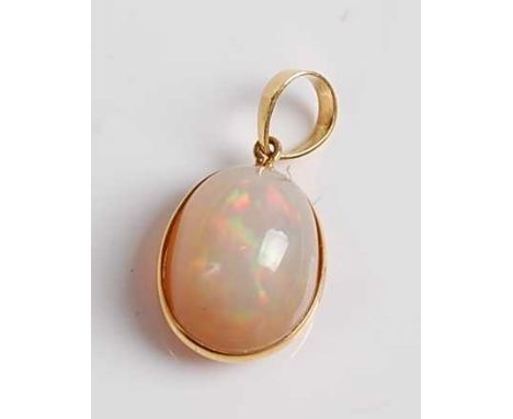 A yellow metal opal pendant, the Ethiopian opal measuring approx 14.0 x 11.2 x 8.8mm, weight estimated as 7.89 carats, gross 