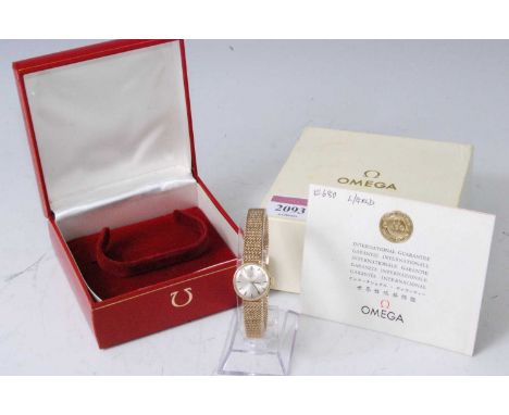 A lady's Omega 9ct gold cased manual wind bracelet watch, circa 1966, having signed champagne dial and baton markers, case di