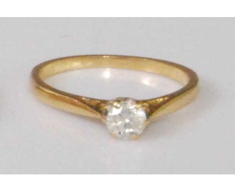 A contemporary 18ct gold diamond solitaire ring, the claw set brilliant weighing approx 0.33 carats, 2.3g, size K