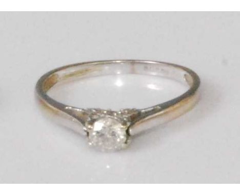 An 18ct white gold diamond solitaire ring, the claw set brilliant weighing approx 0.2 carats, 1.9g, size M