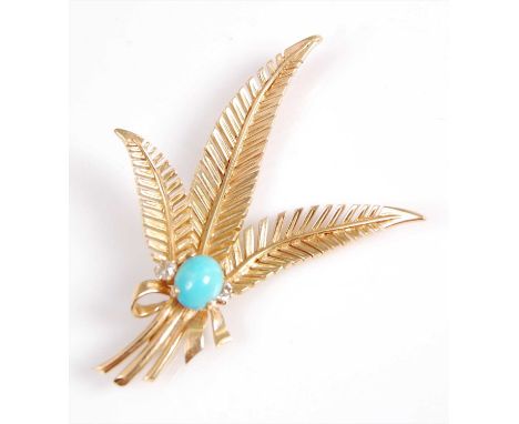 A yellow metal triple feather brooch, featuring an oval cabochon cut turquoise flanked to either side with an Old Mine cut di