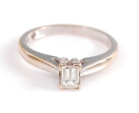 An 18ct white gold single stone diamond ring, featuring a 'millennium' cut diamond in a four-claw setting, diamond dimensions