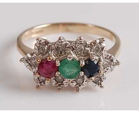 A 9ct yellow and white gold, ruby, emerald, sapphire and diamond triple cluster ring, featuring a centre panel of a round rub