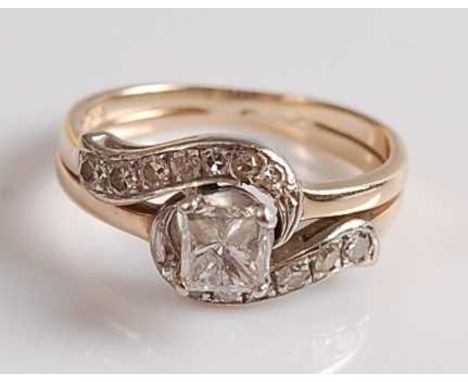A yellow metal diamond solitaire ring, featuring a Princess cut diamond within a two-row crossover style border, each row wit