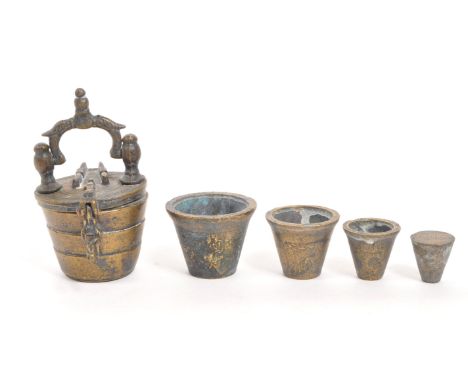 An 18th Century Nuremberg bronze apothecary scale weight set. With three ' cups ' within of graduating sizes. The outer case 
