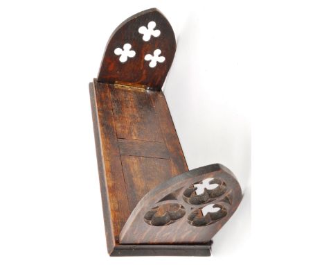 A 19th Century Victorian Gothic revival wooden book slide / extending book rest. The folding shelf leaves with open carved qu