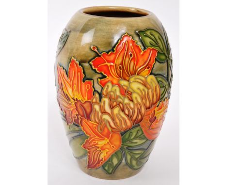 Moorcroft Pottery - A contemporary Flame of the forest ceramic gloss vase. Stamped to underside with initials and date 1997.