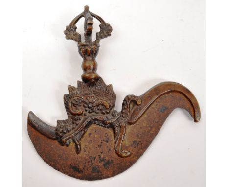 A 19th century Tibetan bronze Kartika Vajra chopper having cast metal ornate details to handle. Measures 17cm lenght.