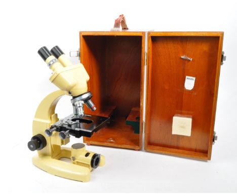 Cooke Troughton and Simms - A vintage mid 20th century Cooke Troughton and Simms microscope. The microscope having a cream bo