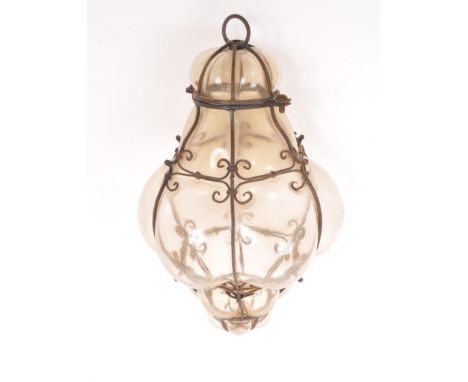 A mid 20th century blown glass ceiling light. Hand blown with caged / imprisoned glass with metal wire work frame. With hangi