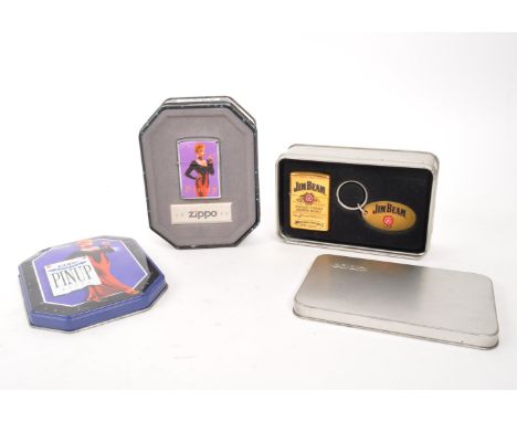 Zippo - Two 20th century Zippo lighters in tins. The collection to include a Zippo Pinup Girl lighter, in original tin, along