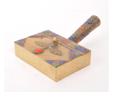 A Chinese brass hot water iron / box warmer with jewel and enamel top. Having hinged lid with floral decoration.9cm x 13cm ap