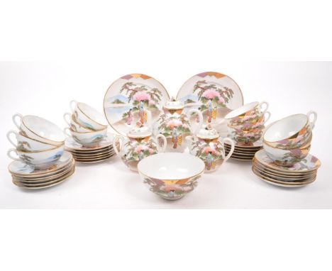 A vintage Japanese porcelain egg shell tea service set painted with traditional Japanese scenes and each teacup having lithop