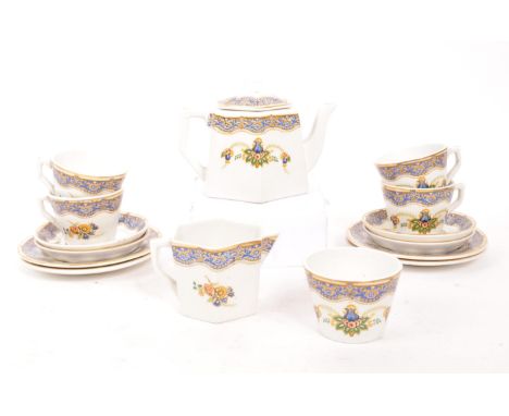 A vintage 20th century child's porcelain tea / coffee service. Four place settings including teapots, saucers, side plates (t