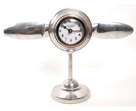 A vintage 20th Century chrome desktop mantel clock in the form of aircraft engine propellers. Makers ' Pour La Maison Jeff Ba