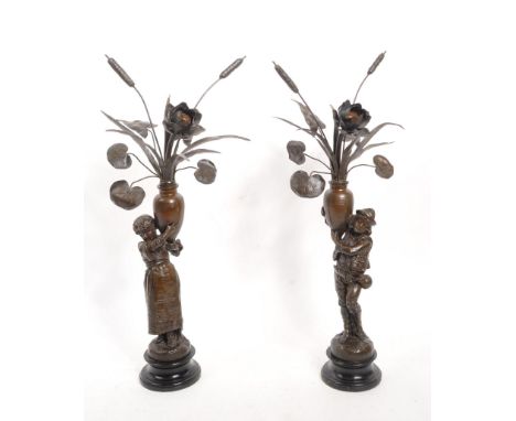 A pair of early 20th century French Jardinere country metal sculptures / converted lamps. Each being cast in the form of coun