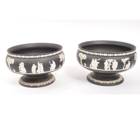 Wedgwood - A pair of 20th Century ceramic Wedgwood black basalt Jasperware pedestal bowls featuring white relief figurative r