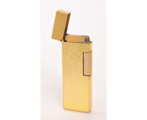 Win - A mid 20th century gold tone Win Japan cigarette lighter. The lighter having gold tone engine turned finish, with hinge